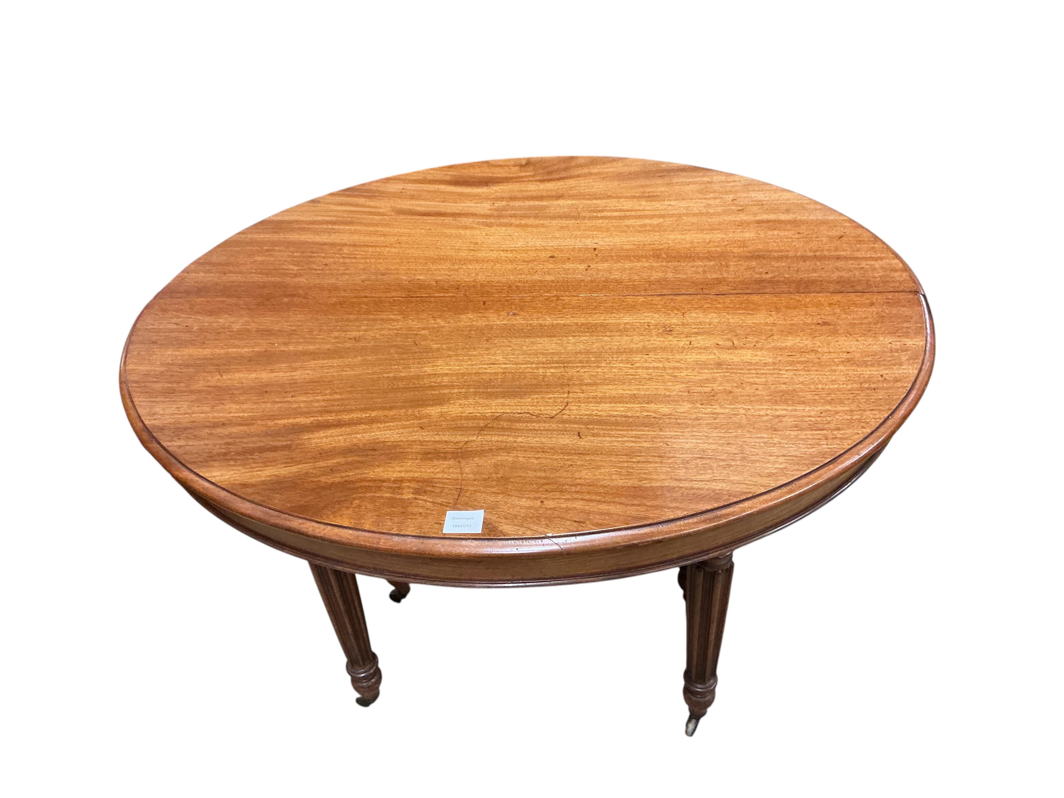 A 19th century French oval mahogany extending dining table, length 214cm extended, two spare leaves, width 102cm, height 70cm